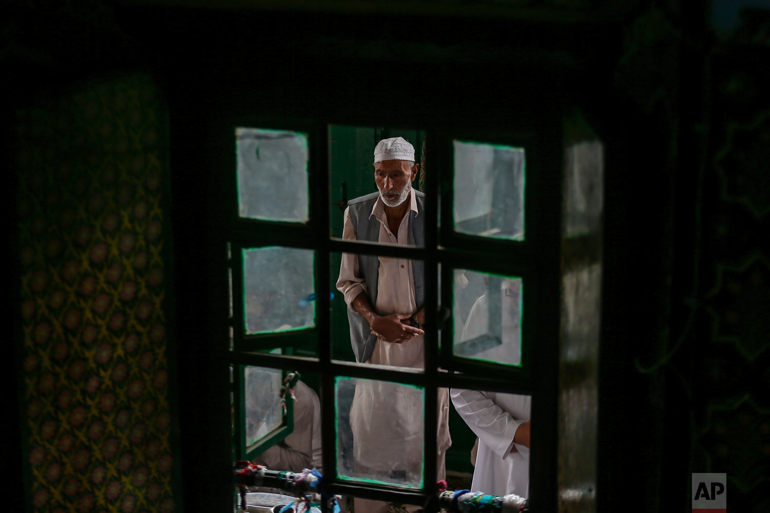 A Kashmiri man prays inside the Shah-e-Hamdan mosque during Ramadan in Srinagar, Indian controlled Kashmir, Friday, June 1, 2018. Islam's holiest month is a period of intense prayer, dawn-to-dusk fasting and nightly feasts. (AP Photo/Dar Yasin)