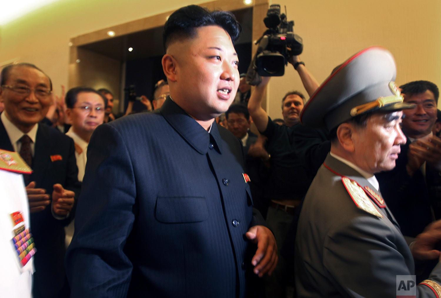 North Korean leader Kim Jong Un, center, is followed by his uncle Jang Song Thaek, second from left, and Yang Hyong Sop, left, vice president of the Presidium of North Korea's parliament, as he tours the newly opened Fatherland Liberation War Museum in Pyongyang on July 27, 2013. On Dec. 13, 2013, North Korea announced the execution Jang Song Thaek, long considered the country's No. 2 power, calling Kim's former mentor a traitor who tried to overthrow the state. (AP Photo/Wong Maye-E) 