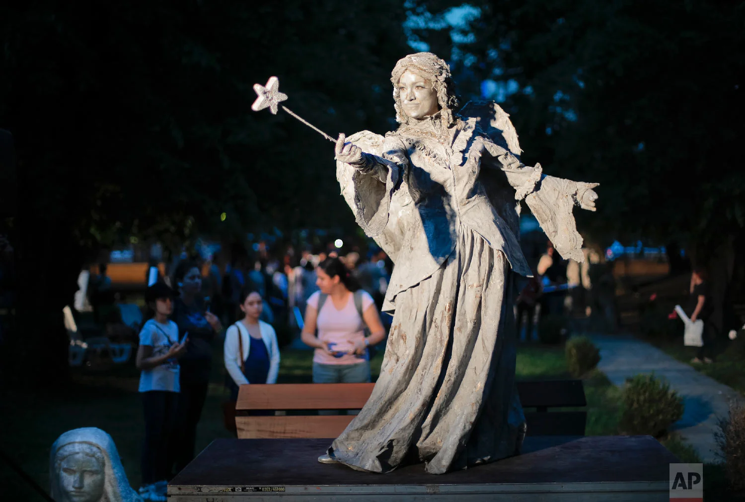 An artist of The Netherlands' Levend Theater performs the Angel character during the Living Statues International Festival, in Bucharest, Romania on Tuesday, May 22, 2018. (AP Photo/Vadim Ghirda)