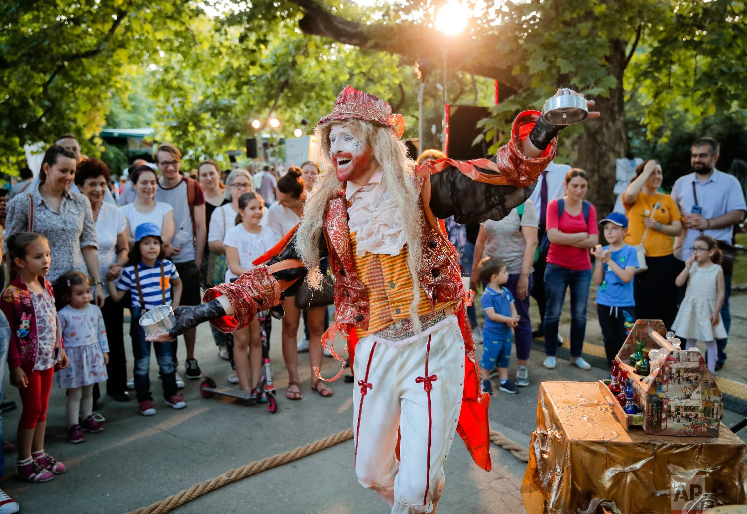 Valentin Mihalache of Romania's Masca theatre performs his Christophe Contugi character, at the Living Statues International Festival, in Bucharest, Romania on Thursday, May 24, 2018. (AP Photo/Vadim Ghirda)