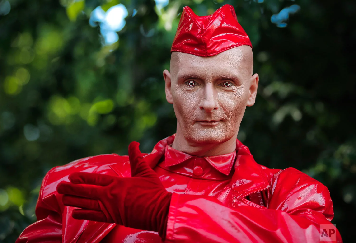 Germany's John Man performs his Candy Man act during the Living Statues International Festival, in Bucharest, Romania on Sunday, May 27, 2018. (AP Photo/Vadim Ghirda)
