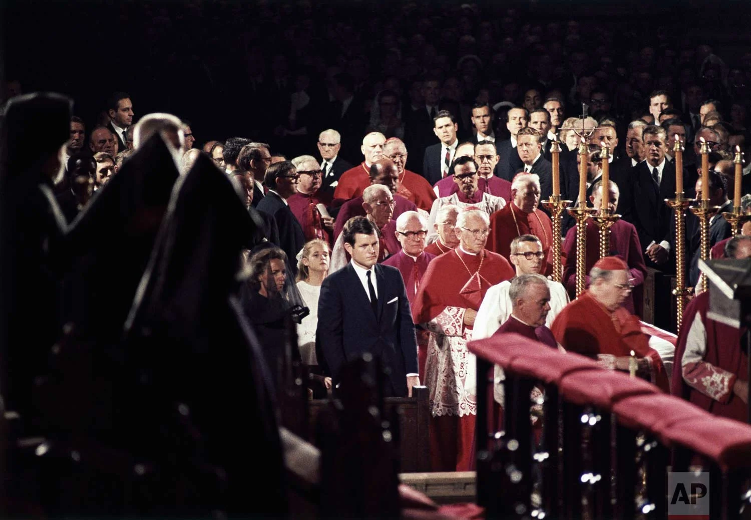 Edward M. Kennedy, center, stands with the widow of his brother, Robert F. Kennedy, during his funeral at St. Patrick's Cathedral in New York, June 8, 1968. (AP Photo)