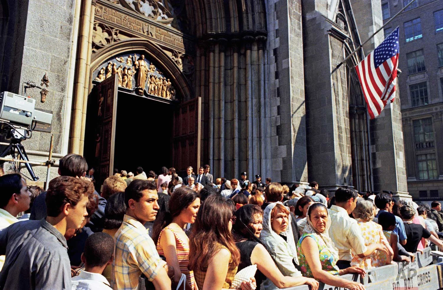 Mourners stand outside of St. Patrick's Cathedral in New York on the day of the funeral for assassinated Sen. Robert F. Kennedy, June 8, 1968. (AP Photo)
