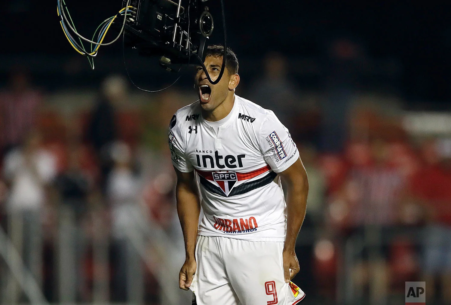 Diego Souza of Brazil's Sao Paulo, celebrates in front of a tv camera after scoring against Argentina's Rosario Central, during a Copa Sudamericana soccer match in Sao Paulo, Brazil, Wednesday, May 9, 2018. (AP Photo/Andre Penner)