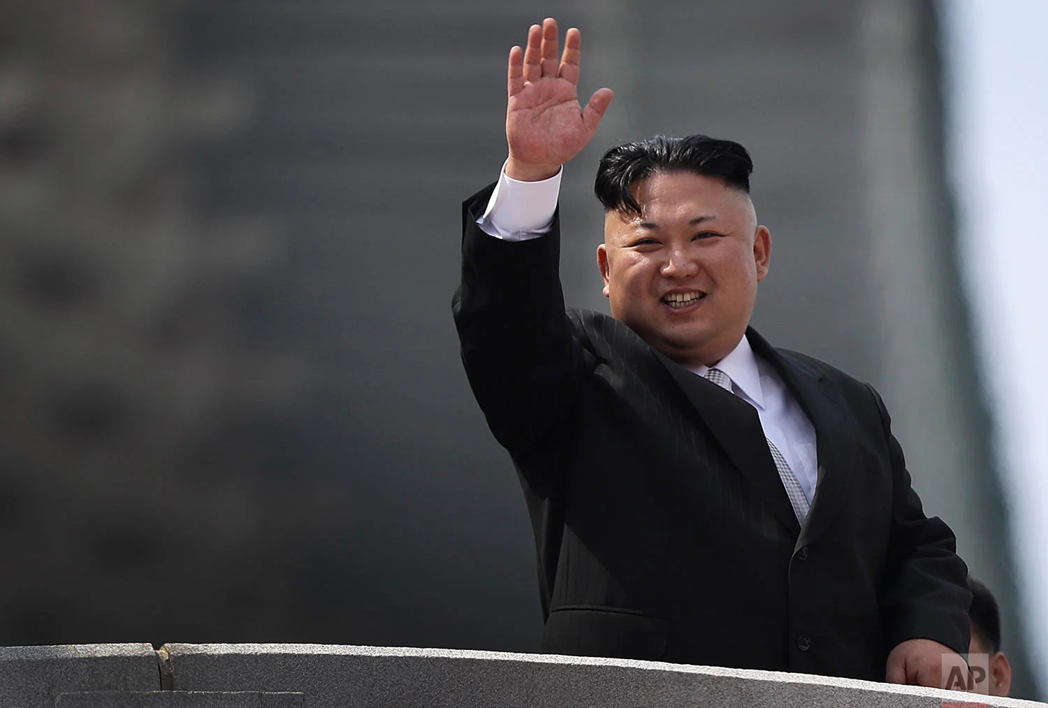 North Korean leader Kim Jong Un waves during a military parade to celebrate the 105th anniversary of the birth of his grandfather, the country's late founder Kim Il Sung, in Pyongyang on April 15, 2017. (AP Photo/Wong Maye-E) 
