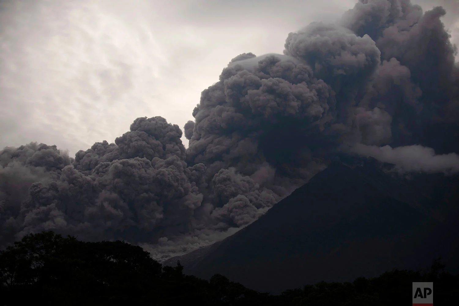 Volcan de Fuego, or Volcano of Fire, blows outs a thick cloud of ash, as seen from Alotenango, Guatemala,&nbsp;June 3, 2018.&nbsp;(AP Photo/Santiago Billy)