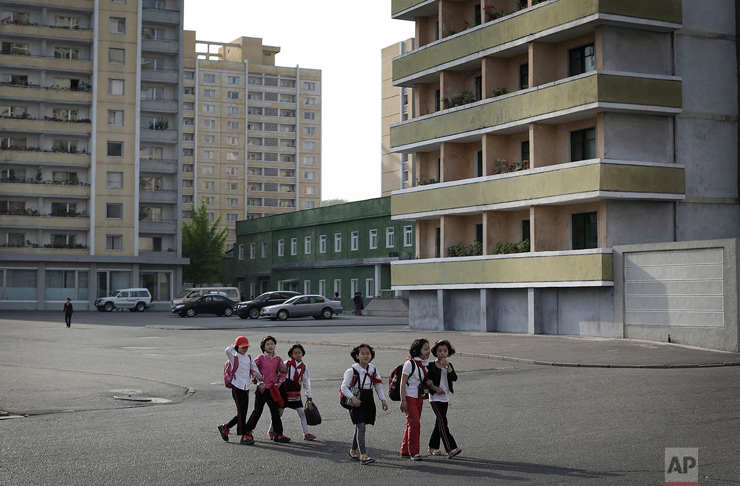 School children walk past an apartment complex in Pyongyang, North Korea, on May 5, 2015. (AP Photo/Wong Maye-E)