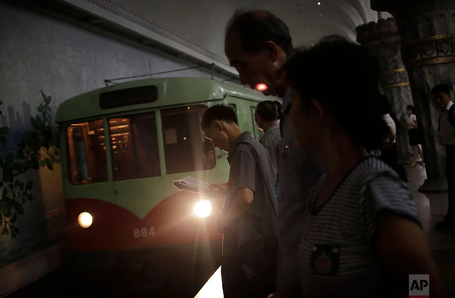 A man reads while waiting for a train in a subway station in Pyongyang, North Korea, on Sept. 1, 2014. Foreign visitors are usually only allowed to take one to two stops on Pyongyang's north-south Chollima subway line. (AP Photo/Wong Maye-E)