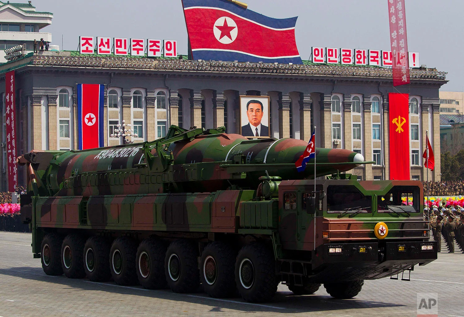 A large 16-wheel truck carries a missile during a massive military parade in Pyongyang's Kim Il Sung Square on April 15, 2012, to celebrate the centenary of the birth of the late North Korean founder Kim Il Sung. (AP Photo/David Guttenfelder)