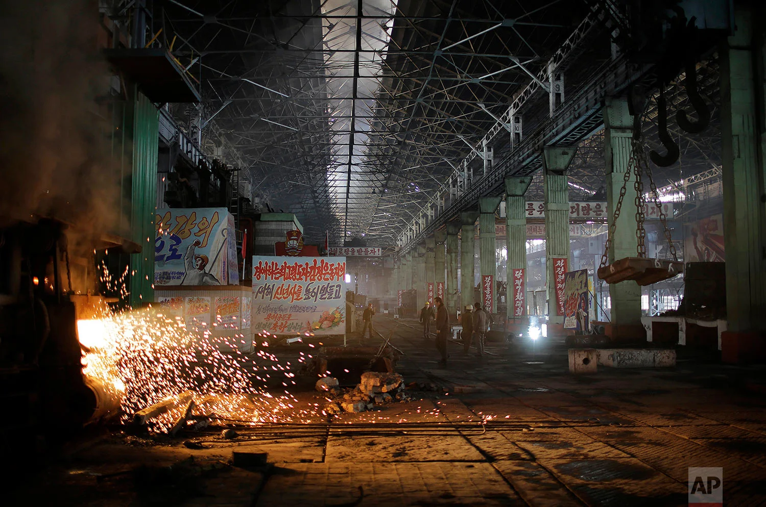 A shaft of light from a furnace shines through the Chollima Steel Complex in Nampo, North Korea, on Jan. 7, 2017. One of seven North Korean steel works, Chollima has more than 8,000 workers and is among the North's showcase enterprises. (AP Photo/Wong Maye-E)
