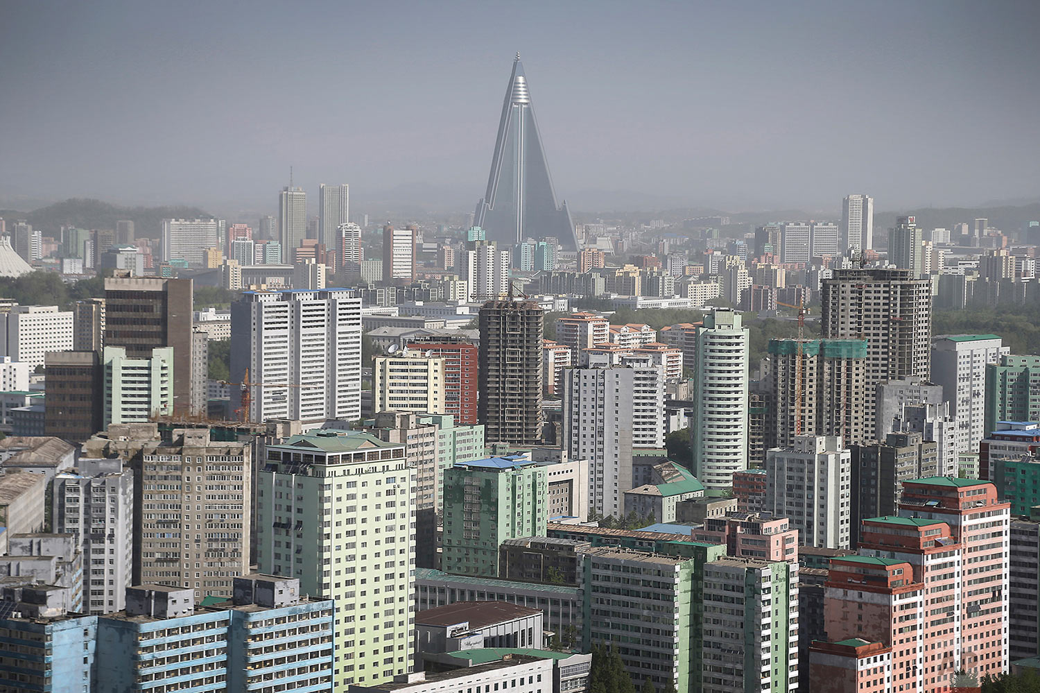 The 105-story pyramid-shaped Ryugyong Hotel towers over residential apartments, forming the skyline of Pyongyang, North Korea, on May 7, 2016. (AP Photo/Wong Maye-E)