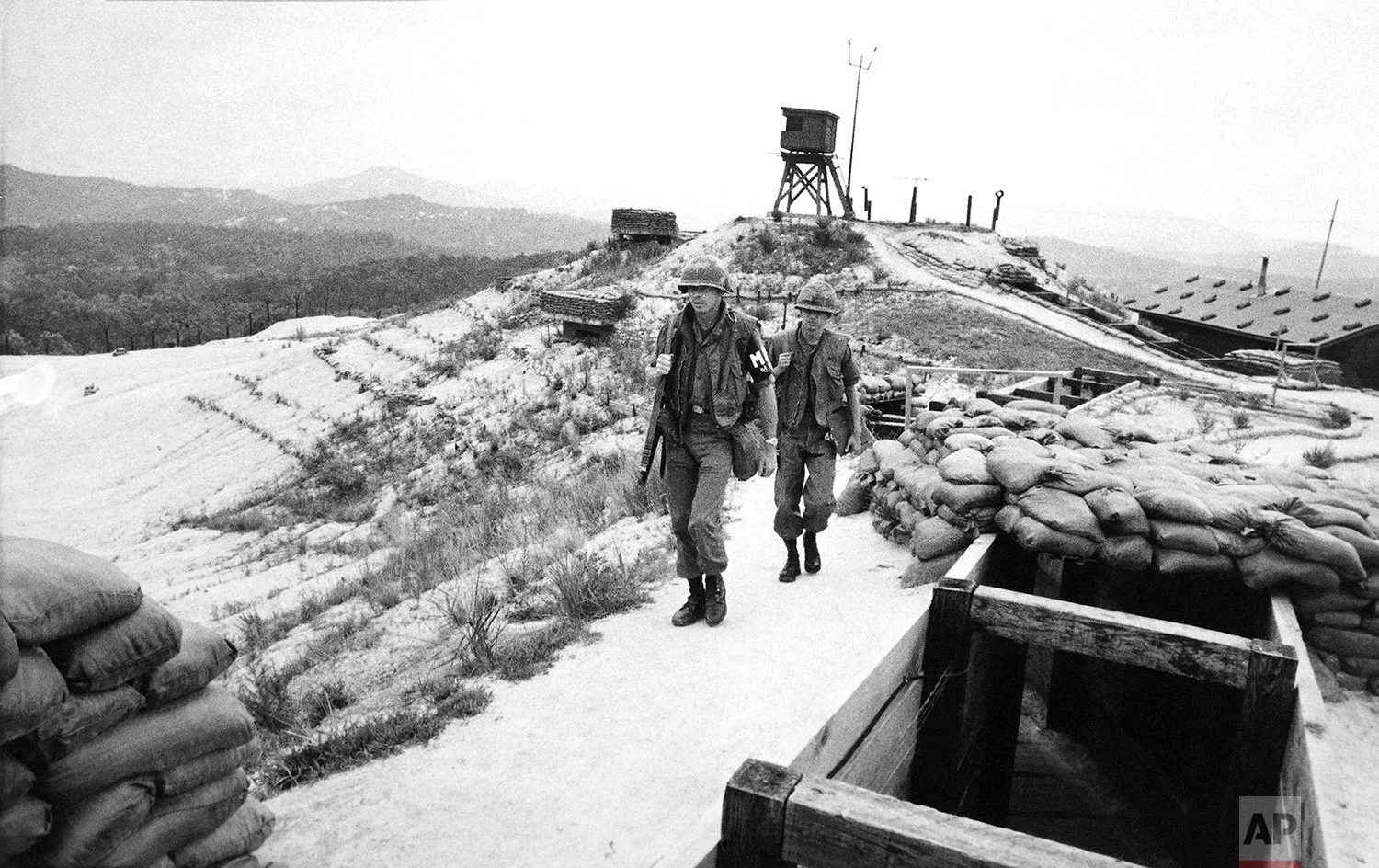 American soldiers patrol along a ridge between observation towers at Ouellette, the northernmost outpost in Korea's Demilitarized Zone manned by U.S. forces, on Sept. 22, 1977. (AP Photo/MD)