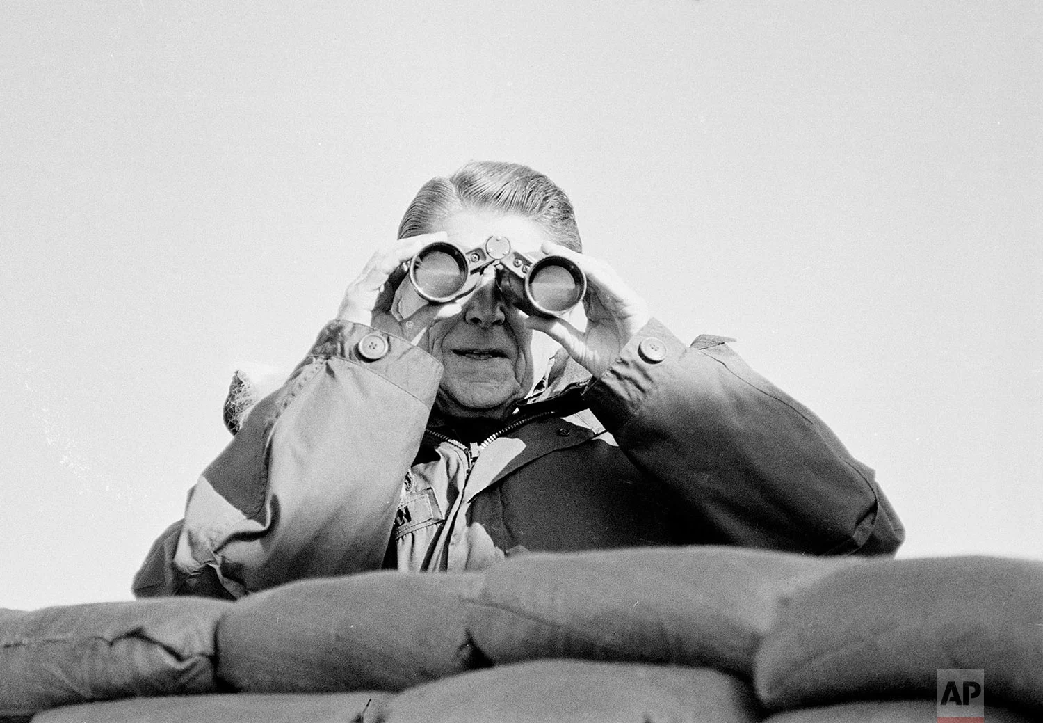 U.S. President Ronald Reagan looks at positions in North Korea from the South Korean side of the Demilitarized Zone on Nov. 13, 1983. (AP Photo/Scott Stewart)