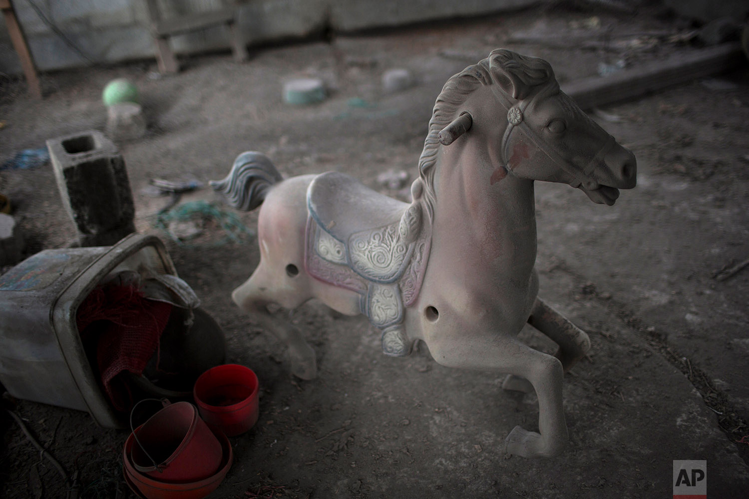  This June 8, 2018 photo shows a spring pony dusted with volcanic ash spewed by the Volcan de Fuego or Volcano of Fire, on the balcony of a home in San Miguel Los Lotes, Guatemala. (AP Photo/Rodrigo Abd) 