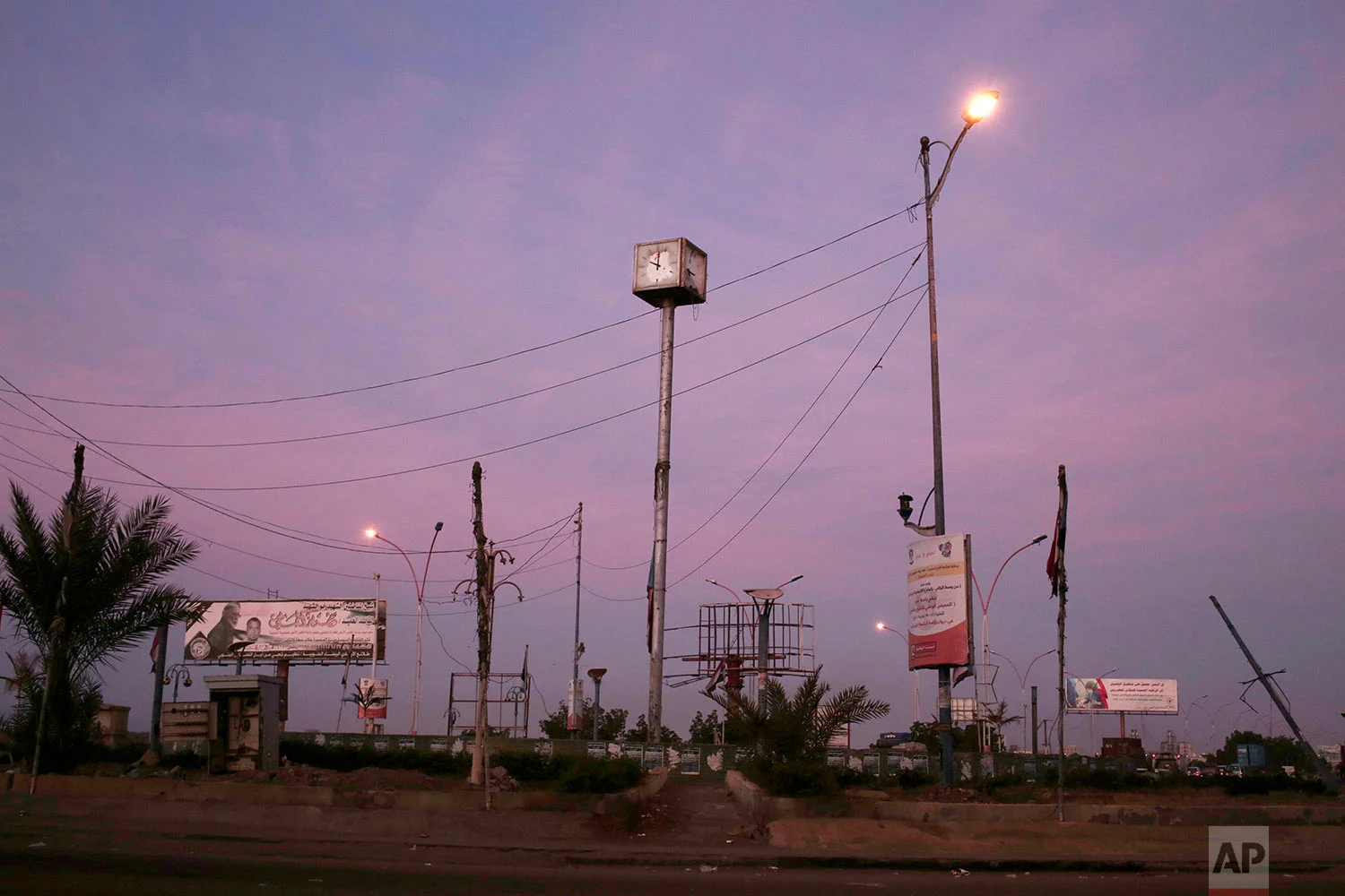 A damaged clock due the ongoing war ahead of sunrise, in Aden, Yemen. (AP Photo/Nariman El-Mofty)