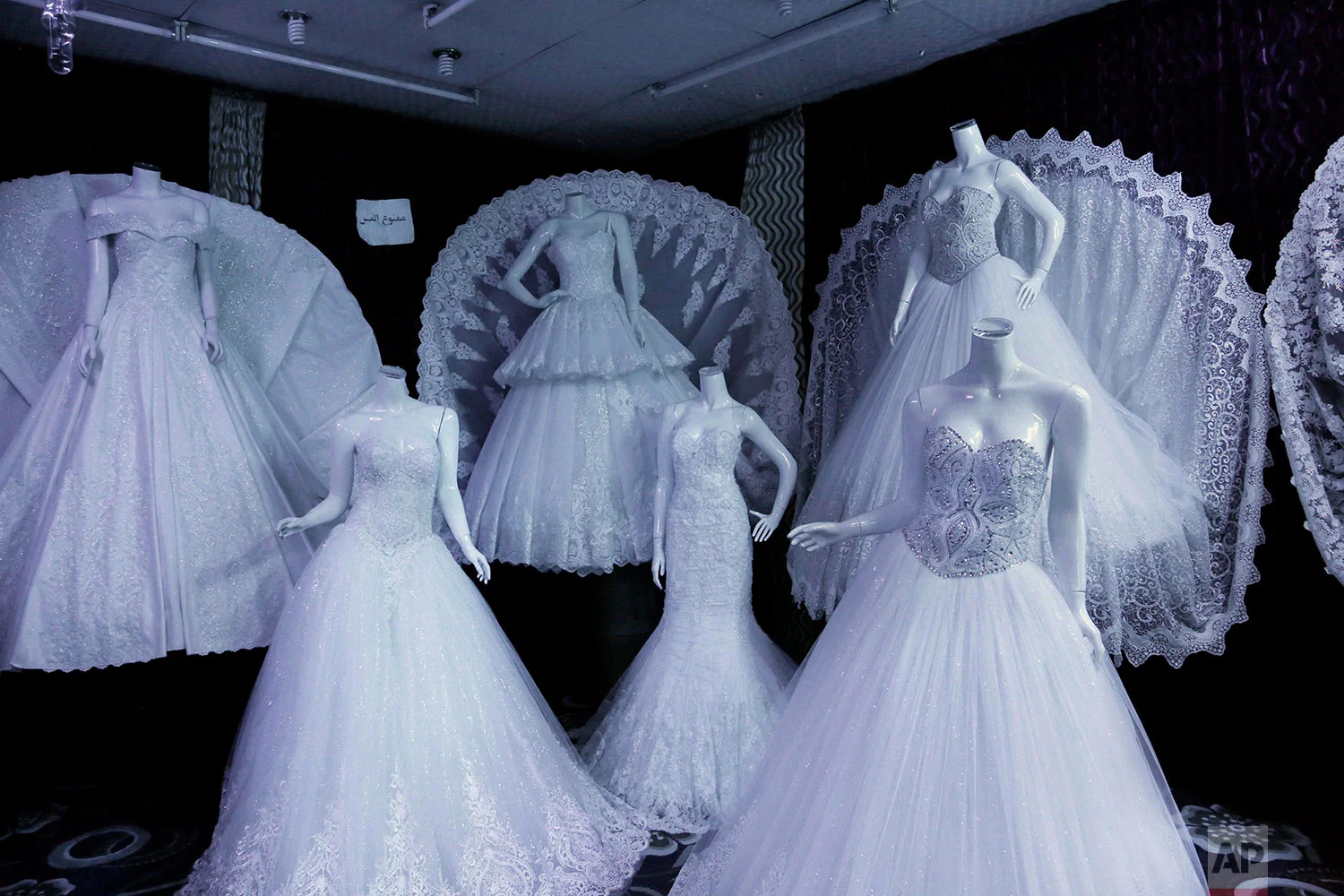 Wedding dresses on display in Lelte boutique on a street in Aden, Yemen. (AP Photo/Nariman El-Mofty)