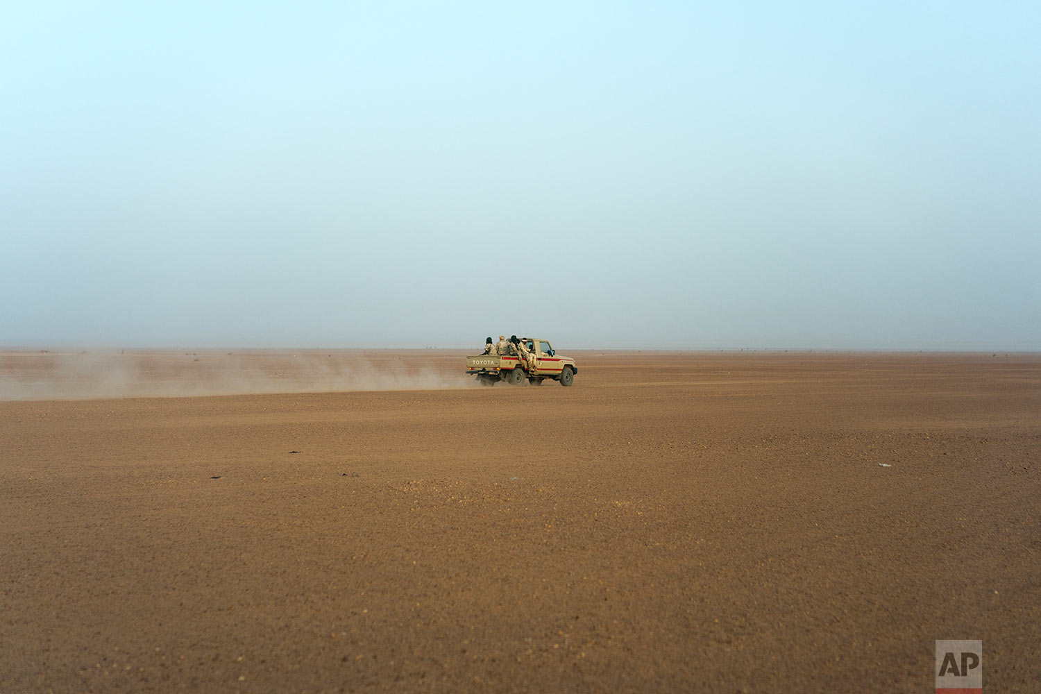  A Nigerian army pickup drives Niger's Tenere desert region of the south central Sahara on June 3, 2018. (AP Photo/Jerome Delay) 