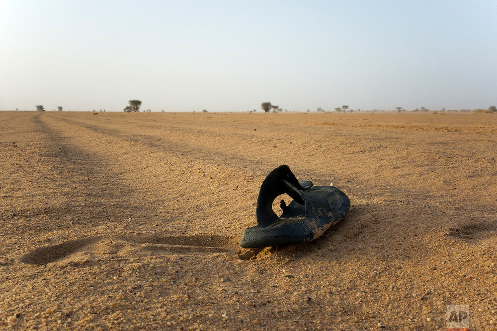  A sandal rests in Niger's Tenere desert region of the south central Sahara on June 3, 2018. (AP Photo/Jerome Delay) 