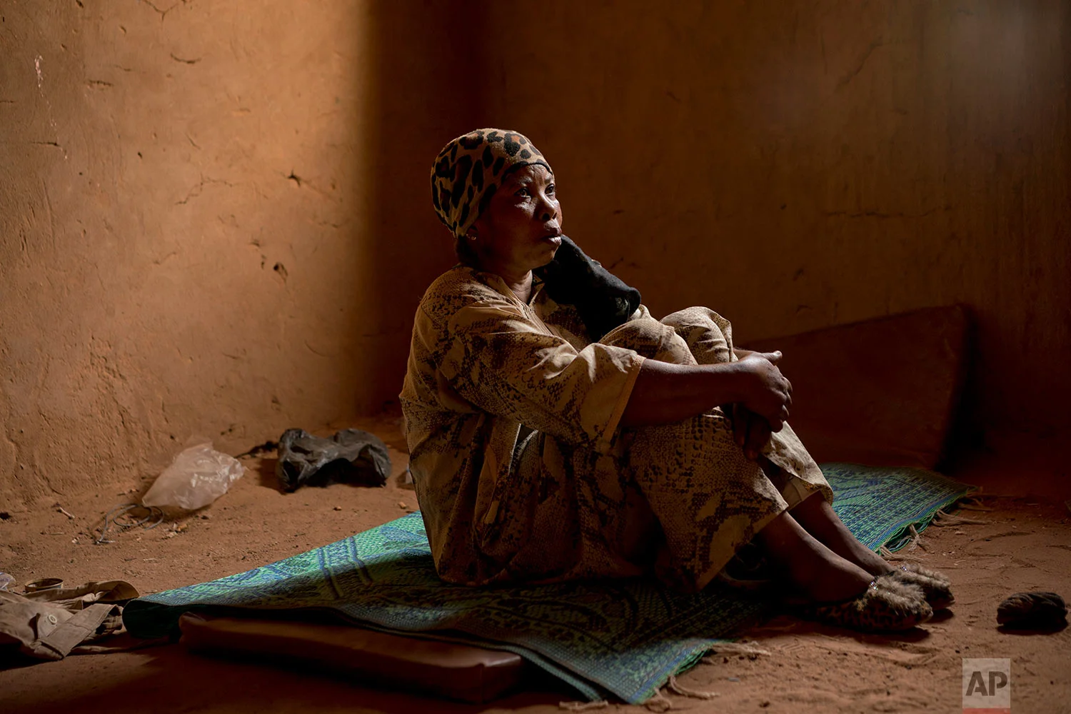 Janet Kamara, from Liberia, sits during an interview conducted in an IOM transit center in Arlit, Niger, on June 2, 2018. (AP Photo/Jerome Delay)