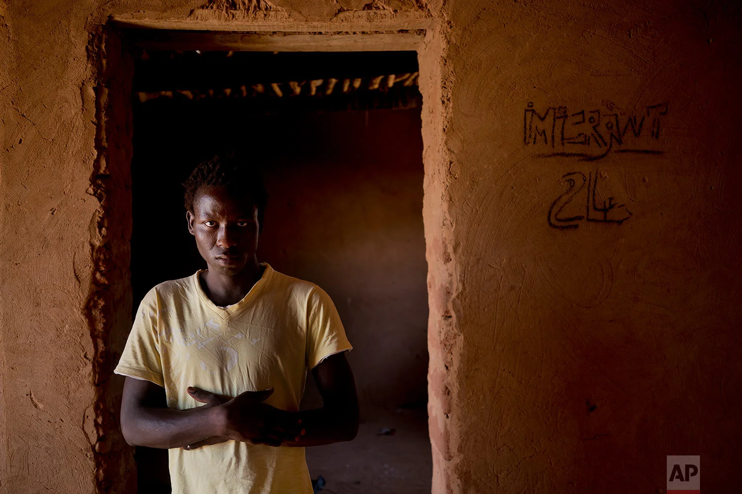 Aliou Kande poses for a photograph in an IOM transit camp in Arlit, Niger, on May 31, 2018. (AP Photo/Jerome Delay)