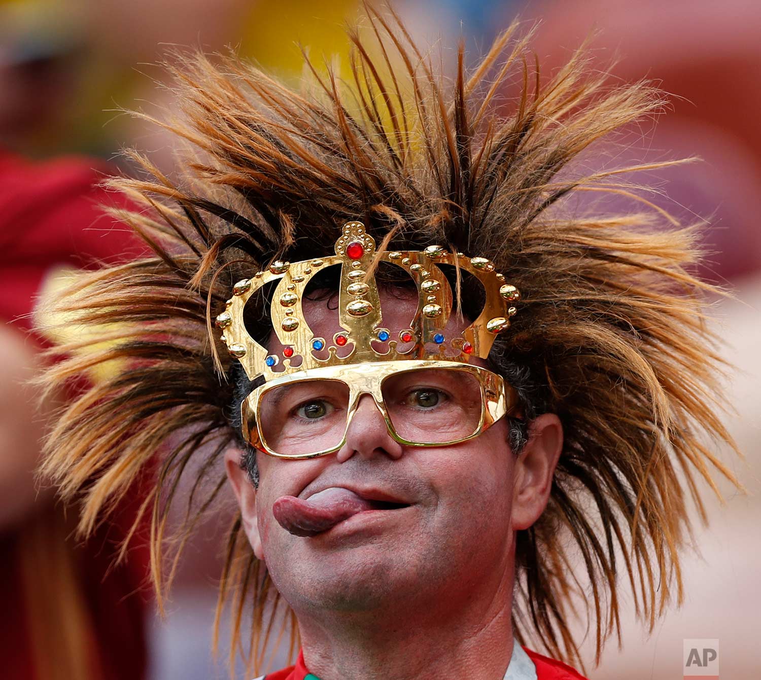  A Portugal's fan sticks his tongue out as he sits in the stands prior to the group B match between Portugal and Morocco at the 2018 soccer World Cup in the Luzhniki Stadium in Moscow, Russia, Wednesday, June 20, 2018. (AP Photo/Francisco Seco) 