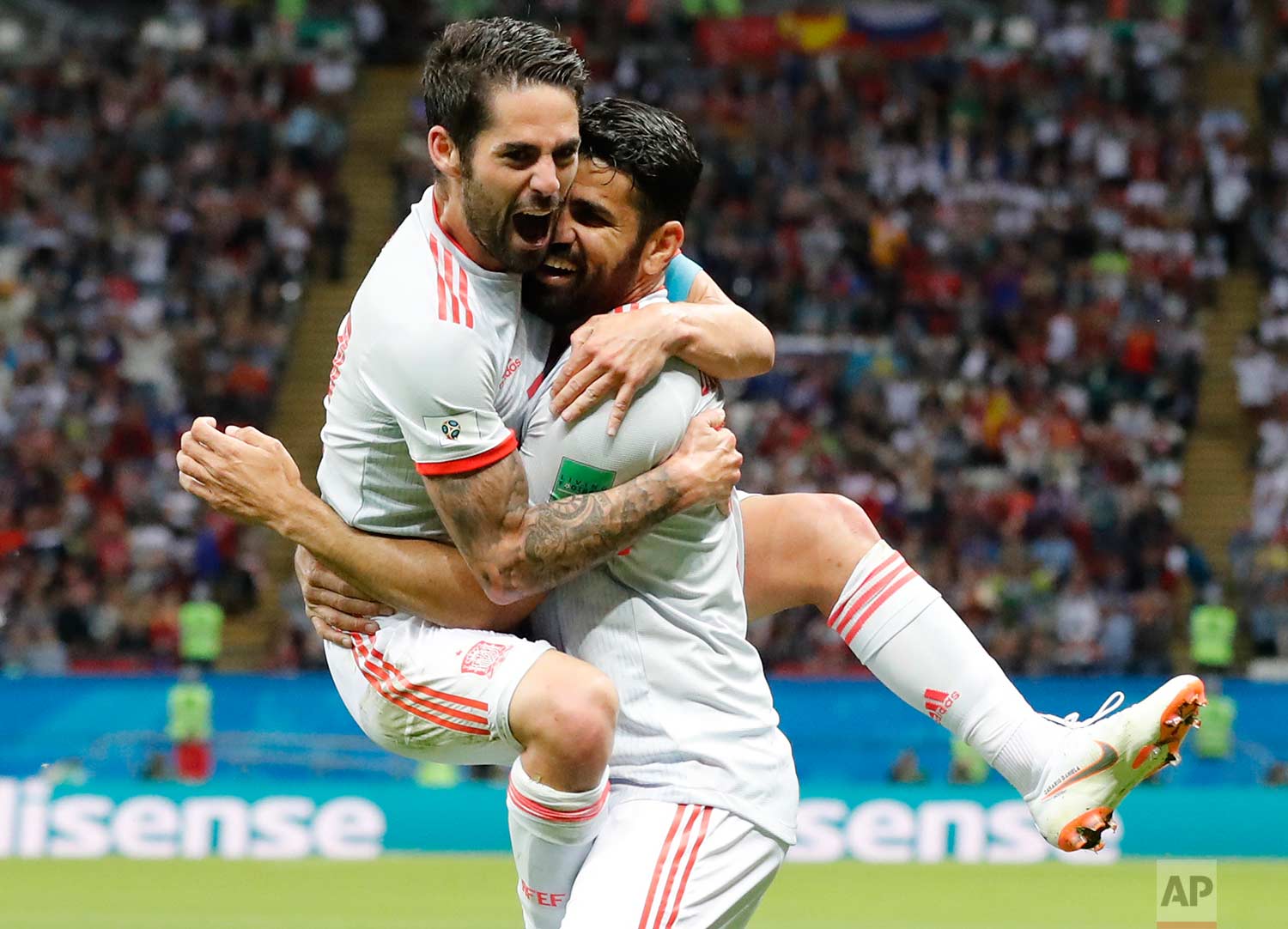  Spain's Diego Costa, right, celebrates with his teammate Isco after scoring his side's opening goal during the group B match between Iran and Spain at the 2018 soccer World Cup in the Kazan Arena in Kazan, Russia, Wednesday, June 20, 2018. (AP Photo