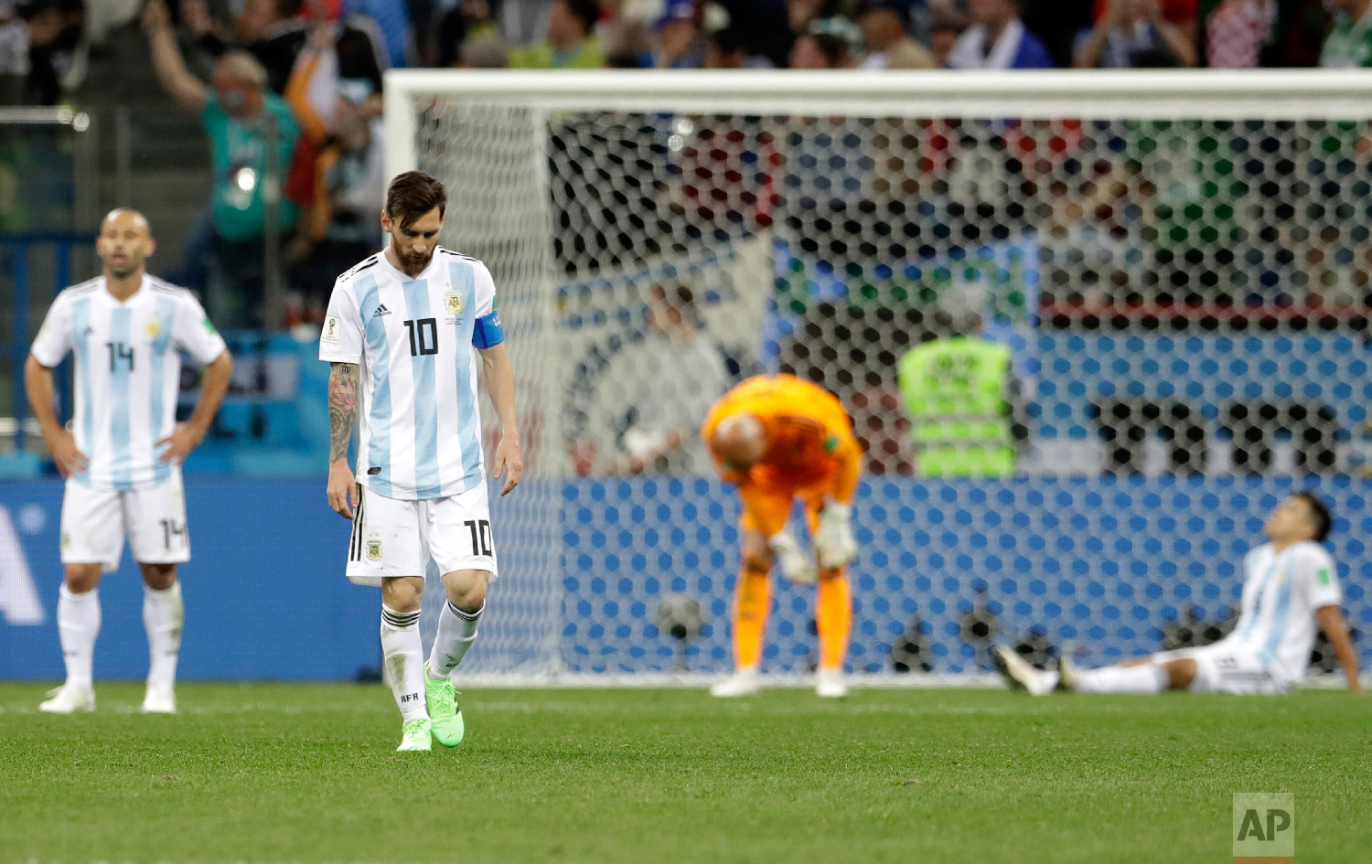Argentina's Lionel Messi, foreground, looks down as he walks on the pitch after the group D match between Argentina and Croatia at the 2018 soccer World Cup in Nizhny Novgorod Stadium in Nizhny Novgorod, Russia, Thursday, June 21, 2018. Croatia won 3-0. (AP Photo/Petr David Josek)