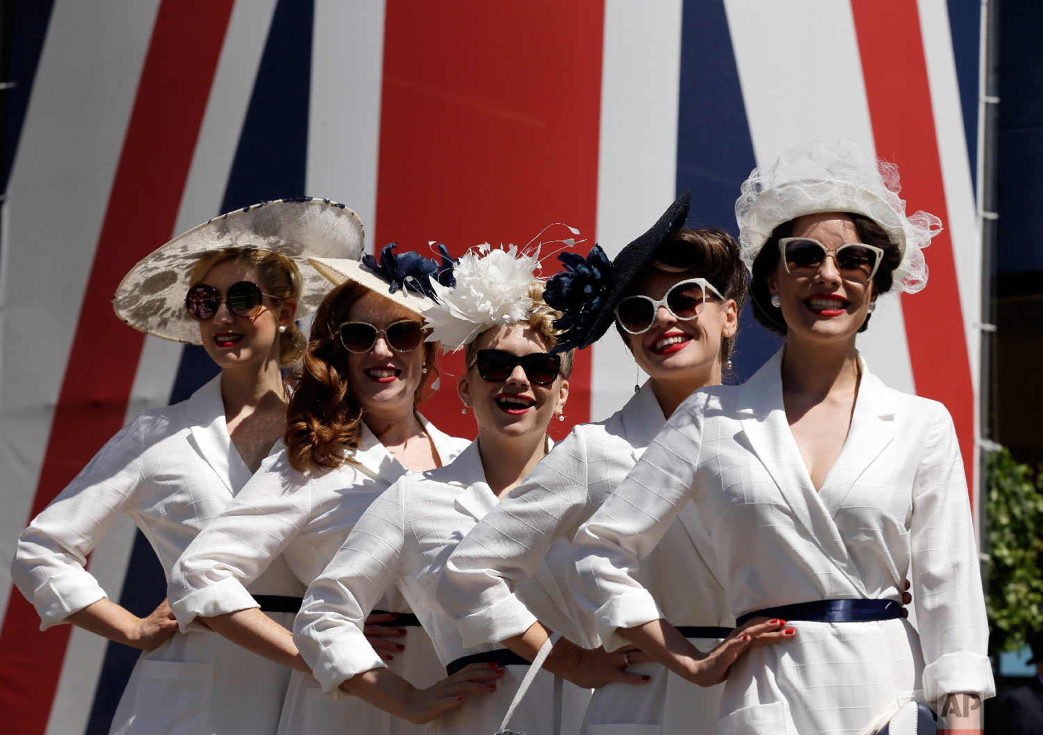  The Tootsie Rollers pose for the media on the third day of the Royal Ascot horse race meeting, which is traditionally known as Ladies Day, in Ascot, England Thursday, June 21, 2018. (AP Photo/Tim Ireland) 