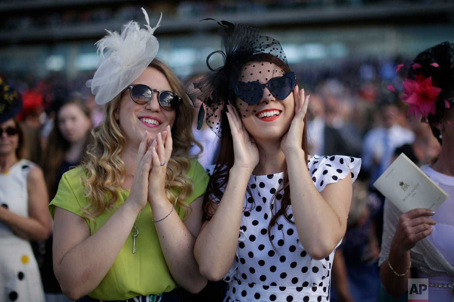  Racegoers watch the fifth and final race on the third day of the Royal Ascot horse race meeting, which is traditionally known as Ladies Day, in Ascot, England Thursday, June 21, 2018. (AP Photo/Tim Ireland) 