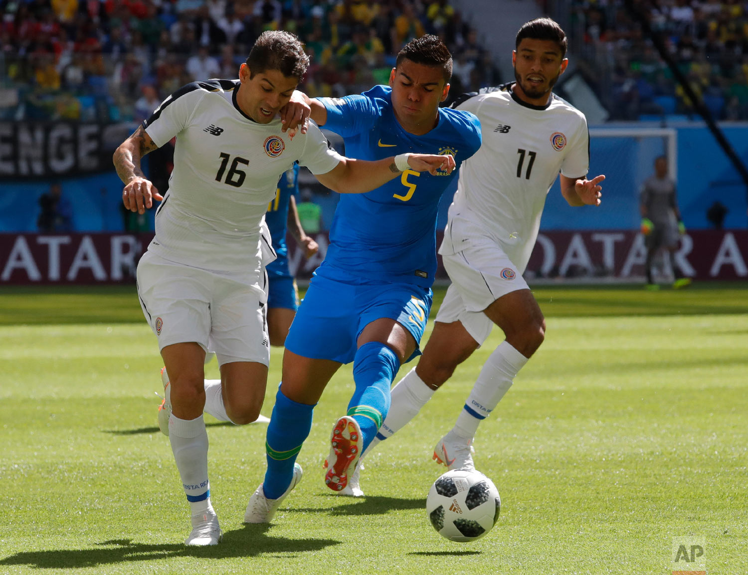 Costa Rica's Cristian Gamboa, left, and Brazil's Casemiro challenge for the ball during the group E match between Brazil and Costa Rica at the 2018 soccer World Cup in the St. Petersburg Stadium in St. Petersburg, Russia, Friday, June 22, 2018. (AP Photo/Dmitri Lovetsky)