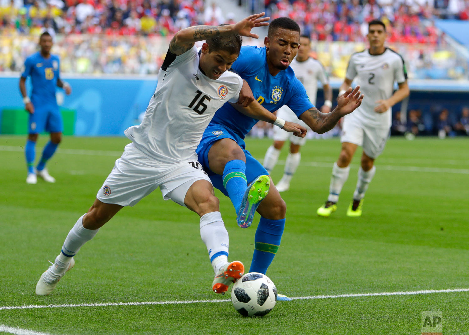 Costa Rica's Cristian Gamboa, left, and Brazil's Gabriel Jesus battle for the ball during the group E match between Brazil and Costa Rica at the 2018 soccer World Cup in the St. Petersburg Stadium in St. Petersburg, Russia, Friday, June 22, 2018. (AP Photo/Alastair Grant)