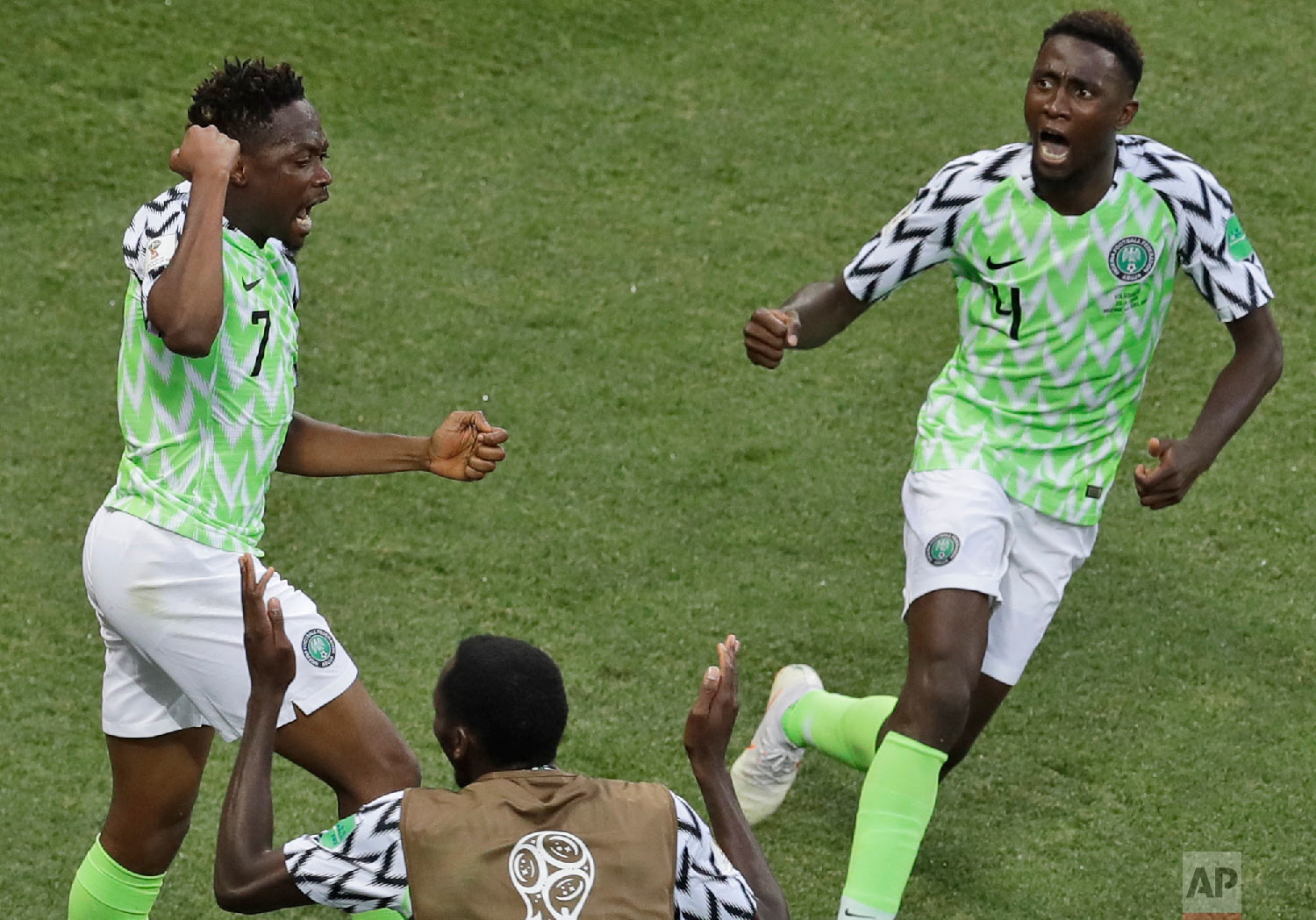 Nigeria's Ahmed Musa, left, celebrates with teammates after scoring his side's opening goal during the group D match between Nigeria and Iceland at the 2018 soccer World Cup in the Volgograd Arena in Volgograd, Russia, Friday, June 22, 2018. (AP Photo/Themba Hadebe)