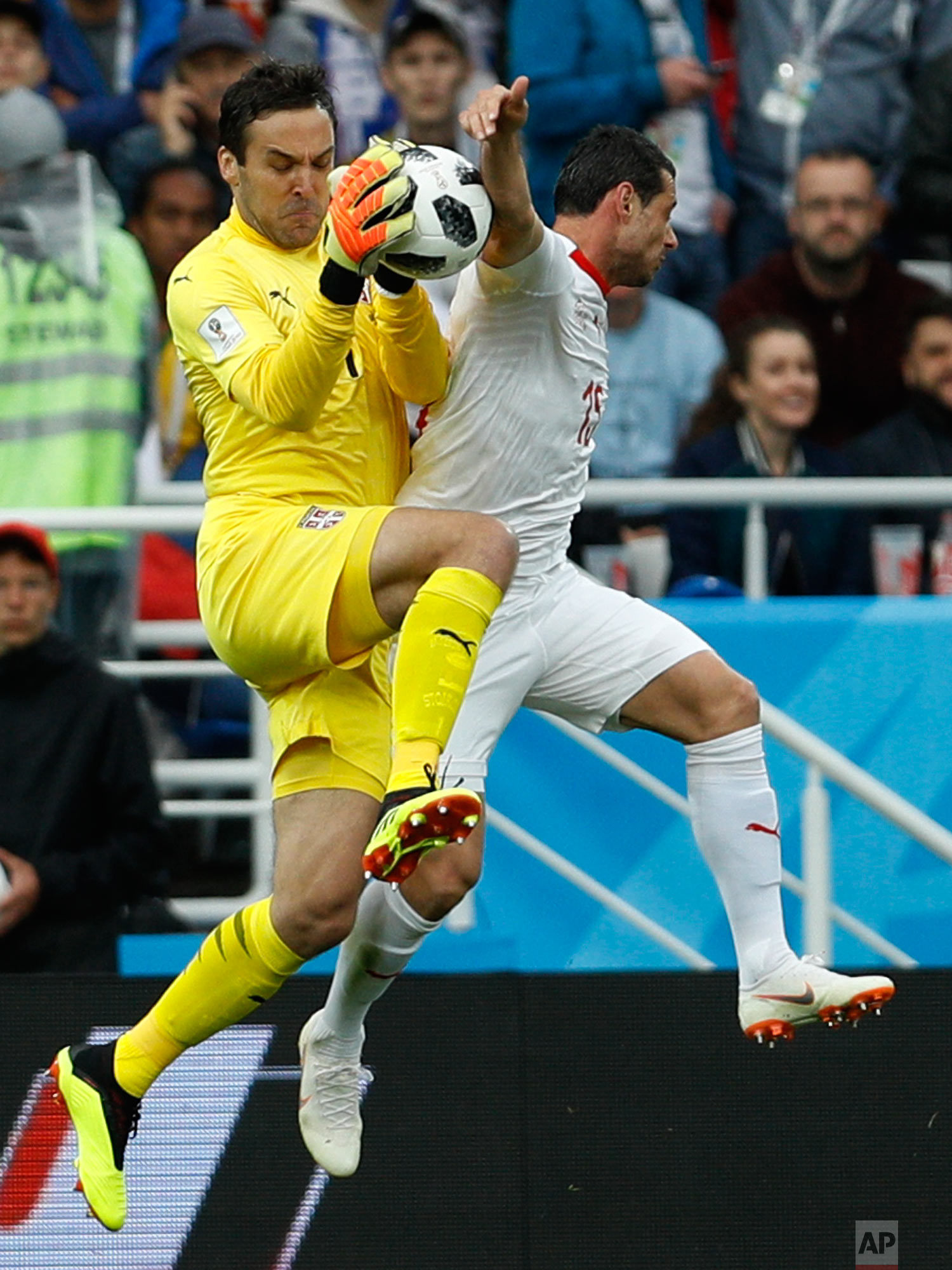 Serbia goalkeeper Vladimir Stojkovic cuts off a shot during the group E match between Switzerland and Serbia at the 2018 soccer World Cup in the Kaliningrad Stadium in Kaliningrad, Russia, Friday, June 22, 2018. (AP Photo/Victor Caivano)