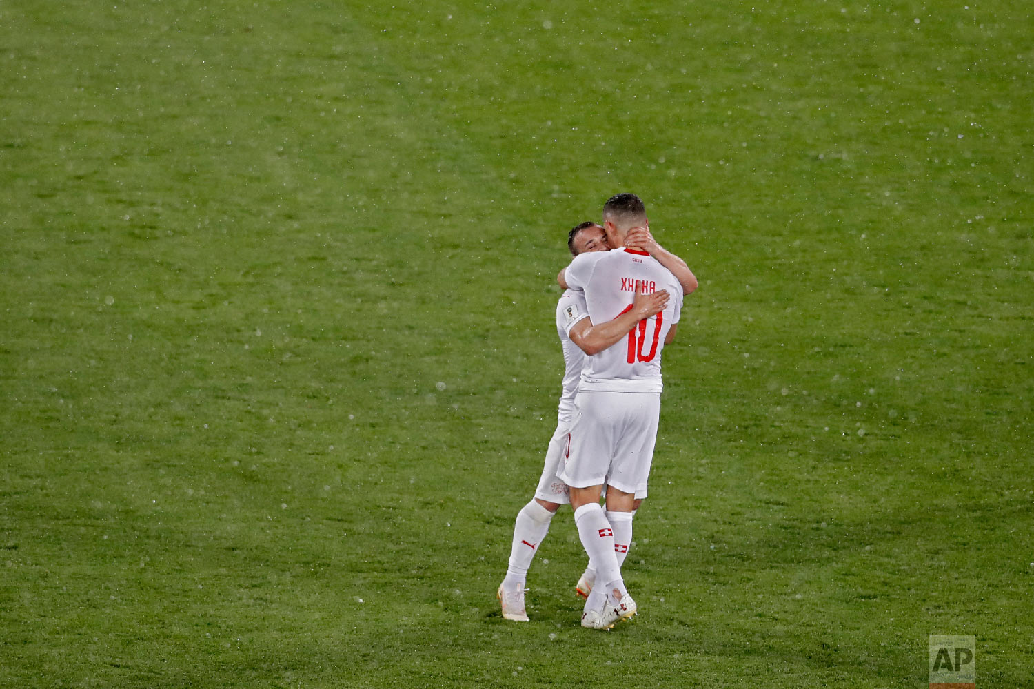 Switzerland's Xherdan Shaqiri and Granit Xhaka, right, celebrate at the end of the group E match between Switzerland and Serbia at the 2018 soccer World Cup in the Kaliningrad Stadium in Kaliningrad, Russia, Friday, June 22, 2018. Shaqiri and Xhaka scored once each in Switzerland's 2-1 victory. (AP Photo/Antonio Calanni)