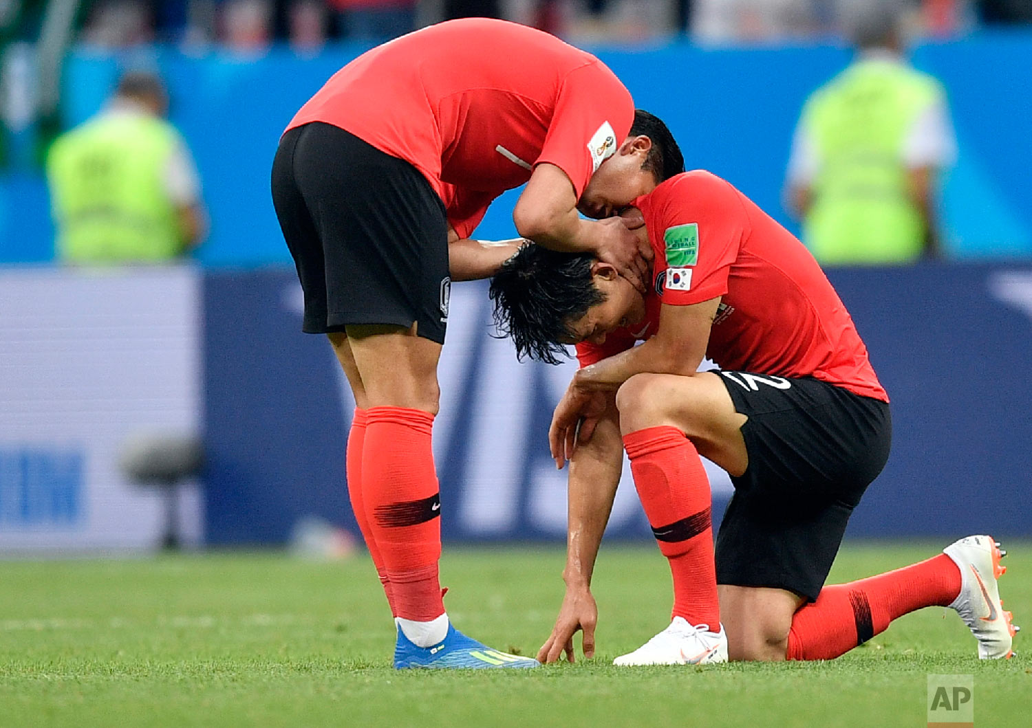 South Korea players console each others at the end of the group F match between Mexico and South Korea at the 2018 soccer World Cup in the Rostov Arena in Rostov-on-Don, Russia, Saturday, June 23, 2018. Mexico won 2-1. (AP Photo/Martin Meissner)