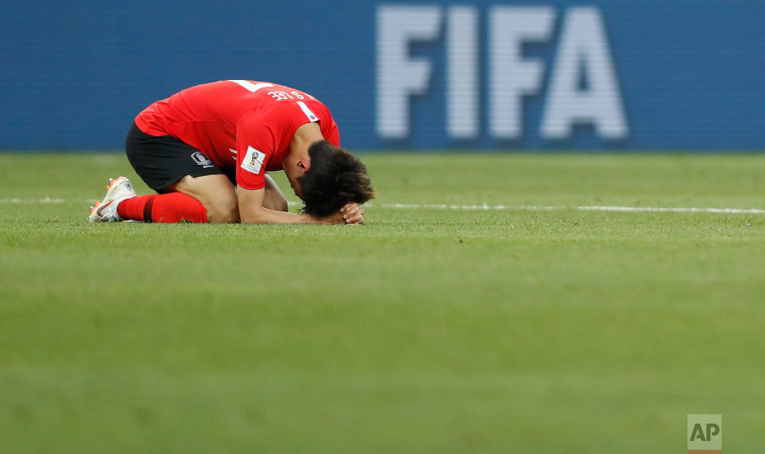 South Korea's Lee Jae-sung lies on the pitch at the end of the group F match between Mexico and South Korea at the 2018 soccer World Cup in the Rostov Arena in Rostov-on-Don, Russia, Saturday, June 23, 2018. (AP Photo/Eduardo Verdugo)