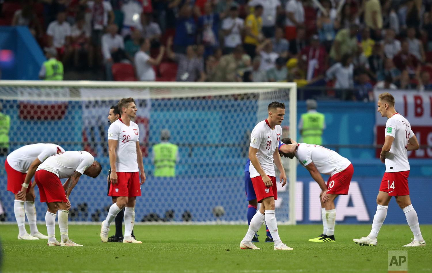 Poland's players react after the group H match between Poland and Colombia at the 2018 soccer World Cup at the Kazan Arena in Kazan, Russia, Sunday, June 24, 2018. Colombia won 3-0. (AP Photo/Thanassis Stavrakis)