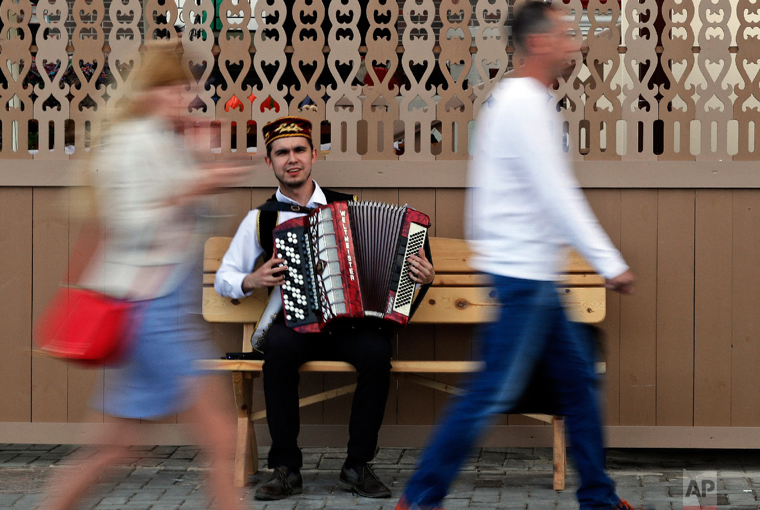 A street musician plays the accordion during the 2018 soccer World Cup in Kazan the capital of the Republic of Tatarstan, Russia on June 21, 2018. (AP Photo/Frank Augstein)