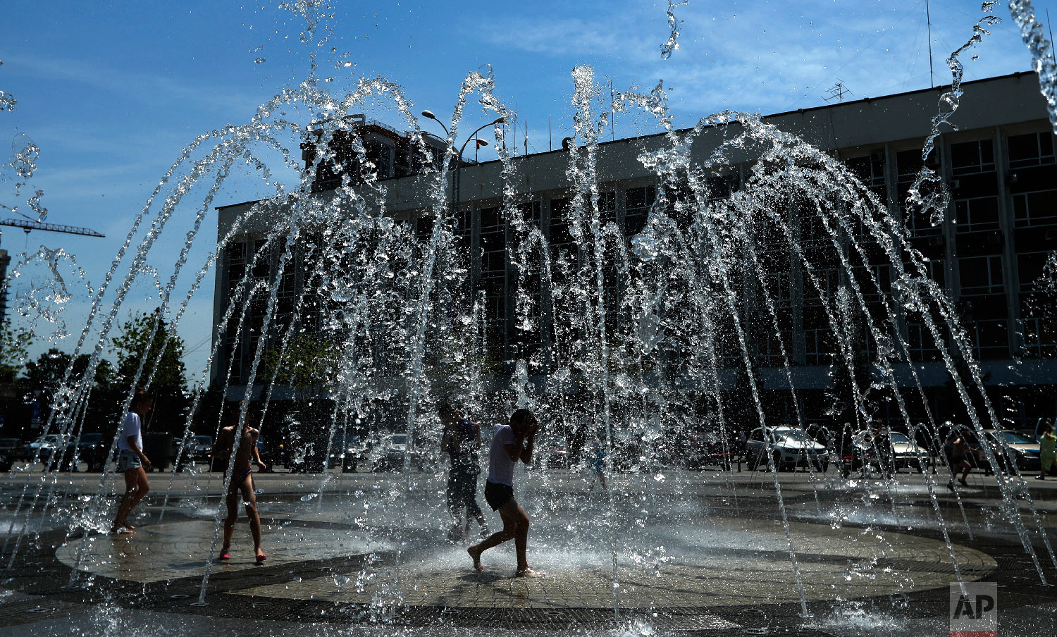  Children cool off in a public fountain during the 2018 soccer World Cup in Krasnodar, Russia on June 22, 2018. (AP Photo/Manu Fernandez) 