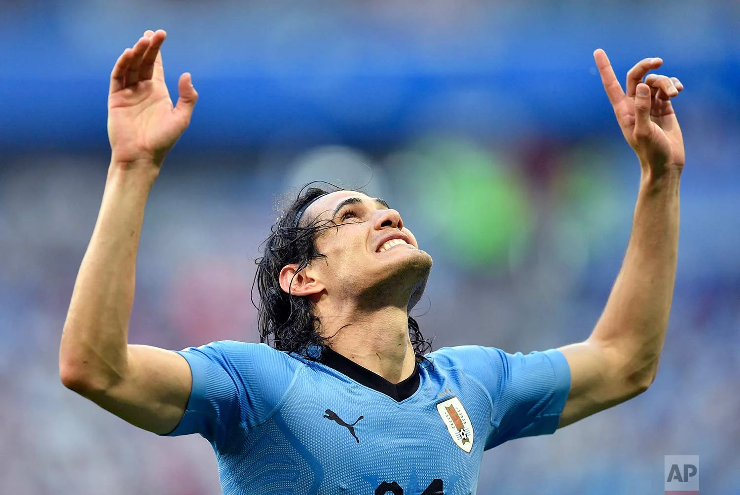 Uruguay's Edinson Cavani celebrates after scoring his team's third goal during the group A match between Uruguay and Russia at the 2018 soccer World Cup at the Samara Arena in Samara, Russia, Monday, June 25, 2018. (AP Photo/Martin Meissner)