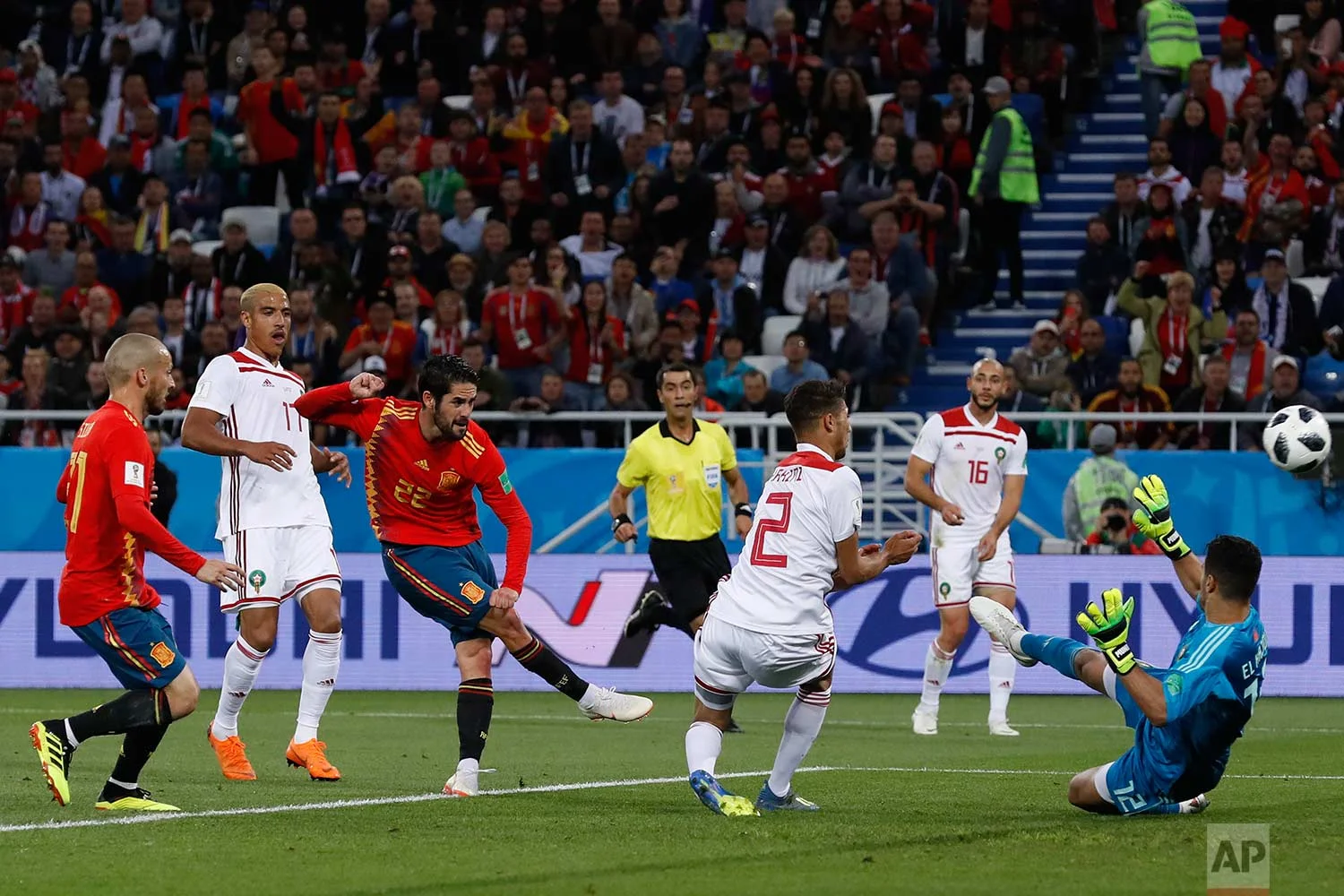 Spain's Isco, 3rd left, scores his side's opening goal during the group B match between Spain and Morocco at the 2018 soccer World Cup at the Kaliningrad Stadium in Kaliningrad, Russia, Monday, June 25, 2018. (AP Photo/Manu Fernandez)
