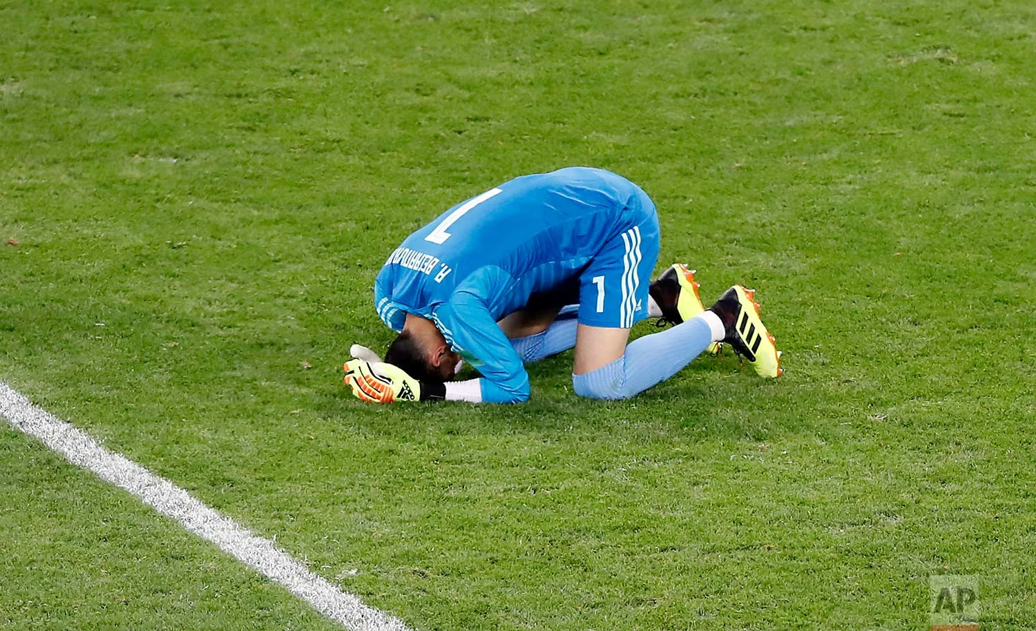 Iran goalkeeper Ali Beiranvand reacts at the end of the group B match between Iran and Portugal at the 2018 soccer World Cup at the Mordovia Arena in Saransk, Russia, Monday, June 25, 2018. (AP Photo/Darko Bandic)