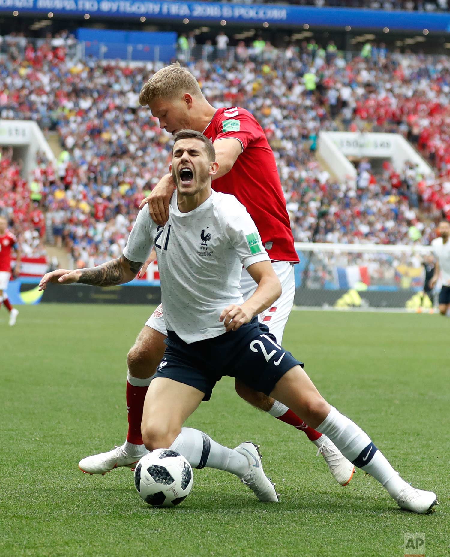  Denmark's Andreas Cornelius, top, vies for the ball with France's Lucas Hernandez during the group C match between Denmark and France at the 2018 soccer World Cup at the Luzhniki Stadium in Moscow, Russia, Tuesday, June 26, 2018. (AP Photo/Antonio C
