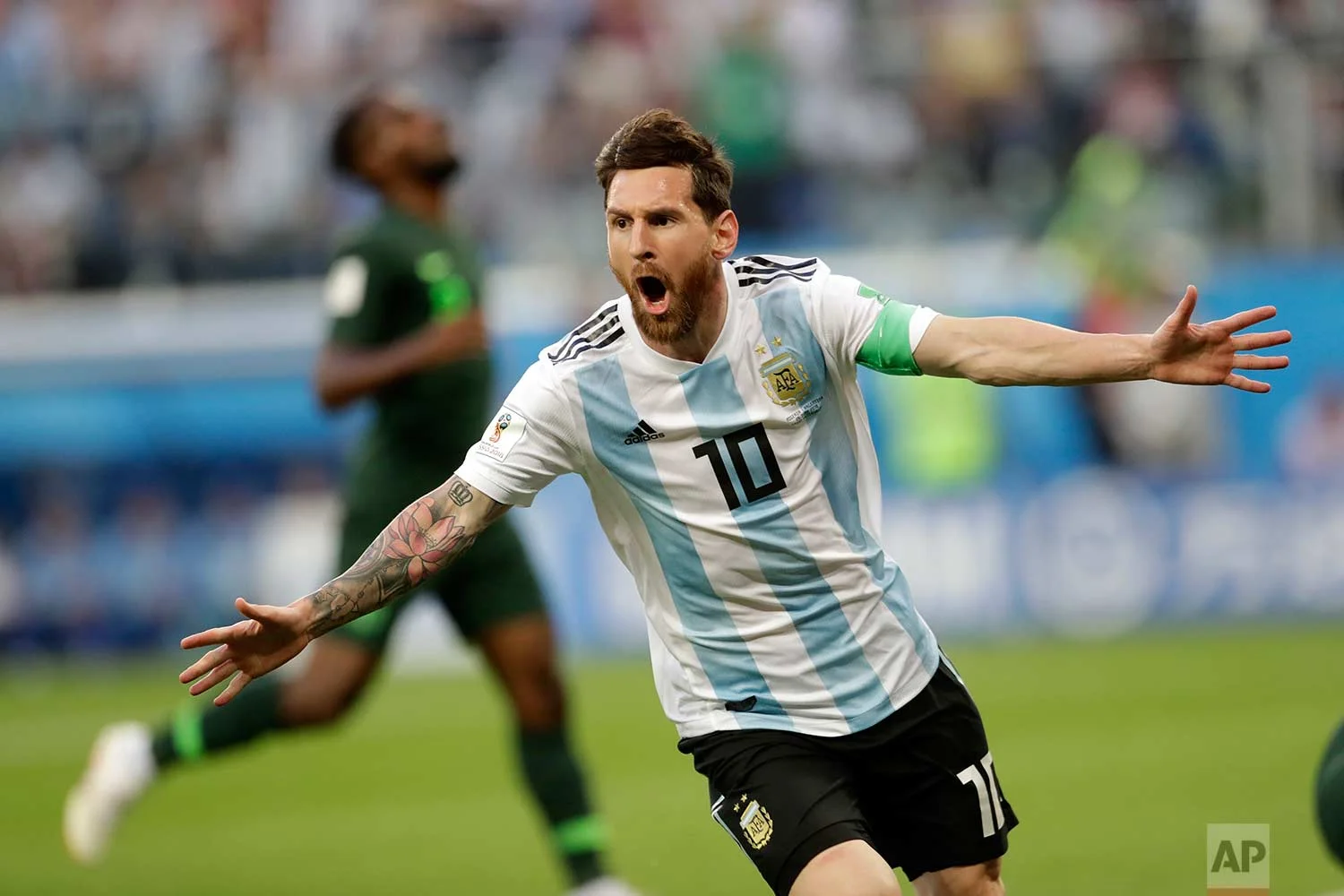 Argentina's Lionel Messi celebrates after scoring the opening goal of his team during the group D match between Argentina and Nigeria, at the 2018 soccer World Cup in the St. Petersburg Stadium in St. Petersburg, Russia, Tuesday, June 26, 2018. (AP Photo/Petr David Josek)