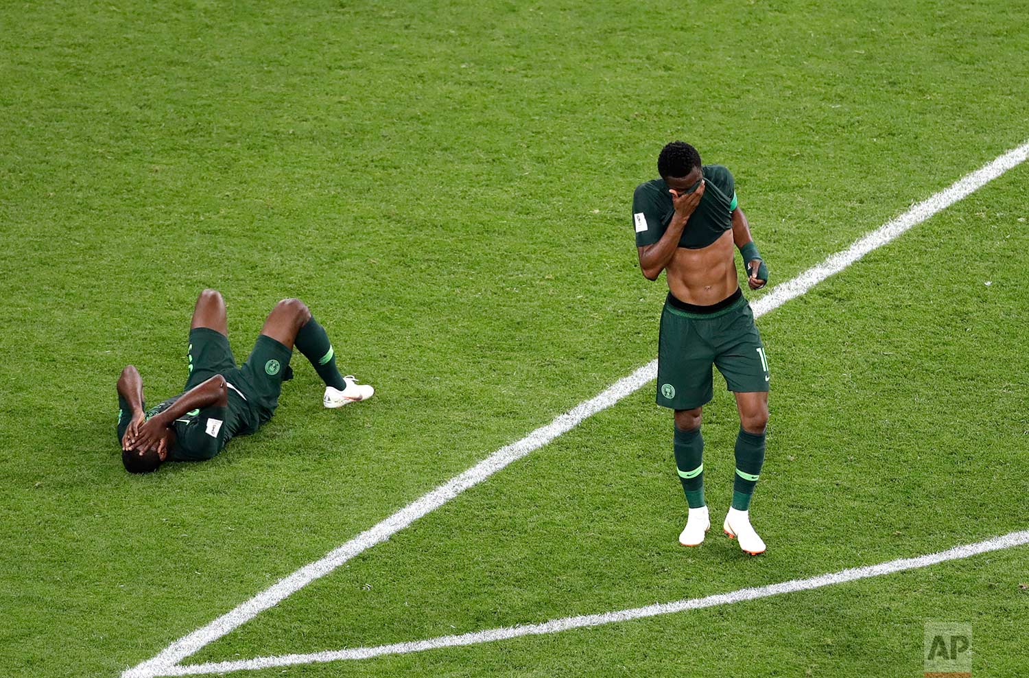  Nigeria players react at the end of the group D match between Argentina and Nigeria, at the 2018 soccer World Cup in the St. Petersburg Stadium in St. Petersburg, Russia, Tuesday, June 26, 2018. Argentina won 2-1. (AP Photo/Michael Sohn) 