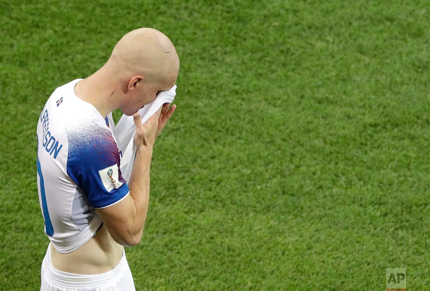 Iceland's Emil Hallfredsson wipes his face at the end of the group D match between Iceland and Croatia, at the 2018 soccer World Cup in the Rostov Arena in Rostov-on-Don, Russia, Tuesday, June 26, 2018. (AP Photo/Mark Baker)