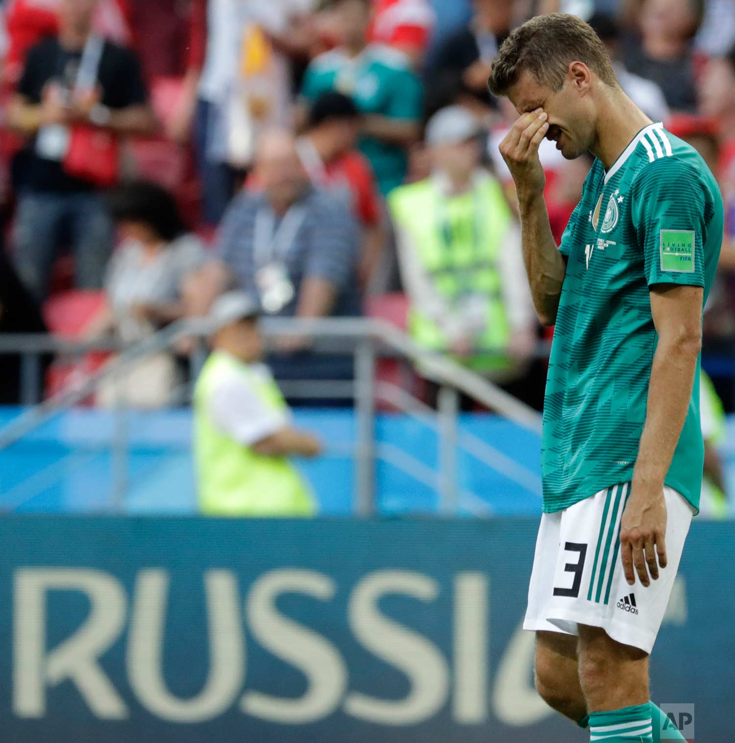 Germany's Thomas Mueller wipes his face after the group F match between South Korea and Germany, at the 2018 soccer World Cup in the Kazan Arena in Kazan, Russia, Wednesday, June 27, 2018. (AP Photo/Lee Jin-man)