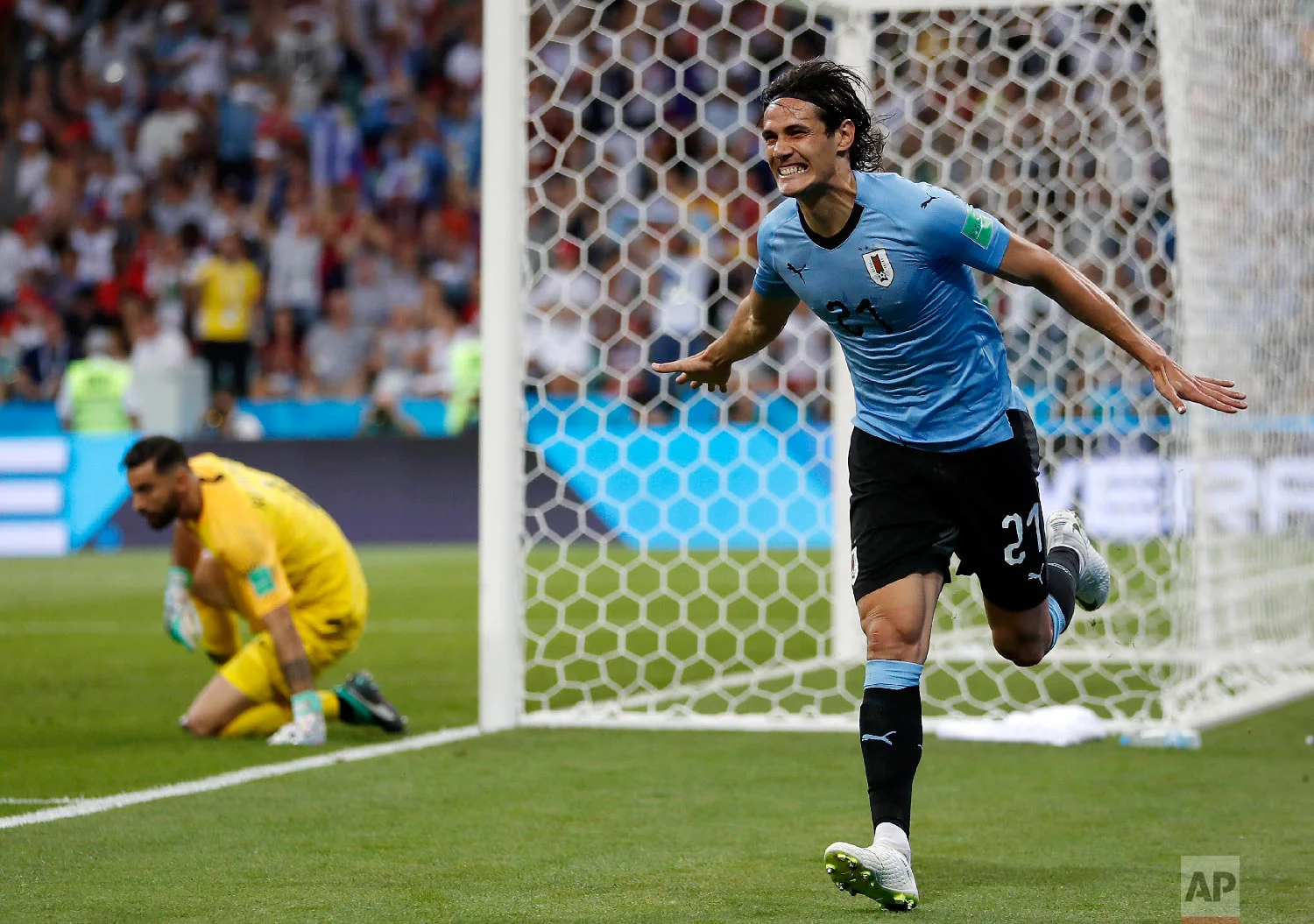 Uruguay's Edinson Cavani celebrates after he scored the opening goal during the round of 16 match between Uruguay and Portugal at the 2018 soccer World Cup at the Fisht Stadium in Sochi, Russia, Saturday, June 30, 2018. (AP Photo/Francisco Seco)