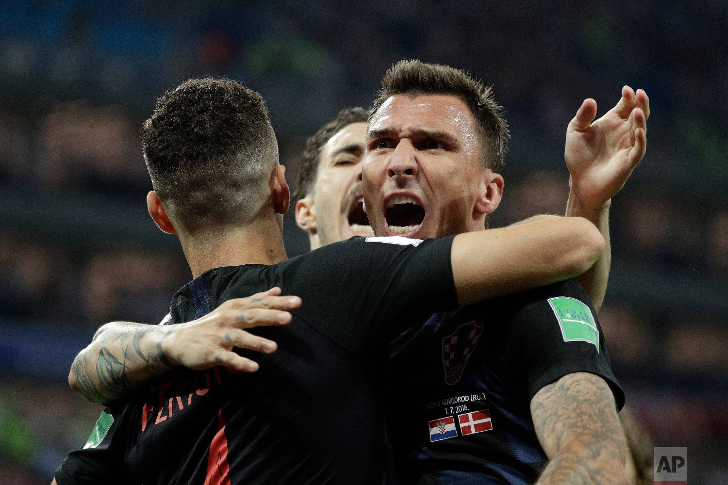  Croatia's Mario Mandzukic, right, celebrates with his teammates after scoring the opening goal of his team during the round of 16 match between Croatia and Denmark at the 2018 soccer World Cup in the Nizhny Novgorod Stadium, in Nizhny Novgorod, Russ