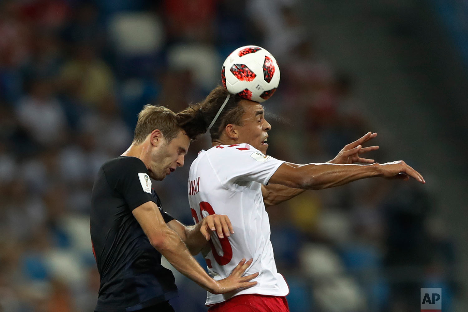  Denmark's Yussuf Yurary Poulsen, right, goes for a header with Croatia's Ivan Strinic during the round of 16 match between Croatia and Denmark at the 2018 soccer World Cup in the Nizhny Novgorod Stadium, in Nizhny Novgorod , Russia, Sunday, July 1, 